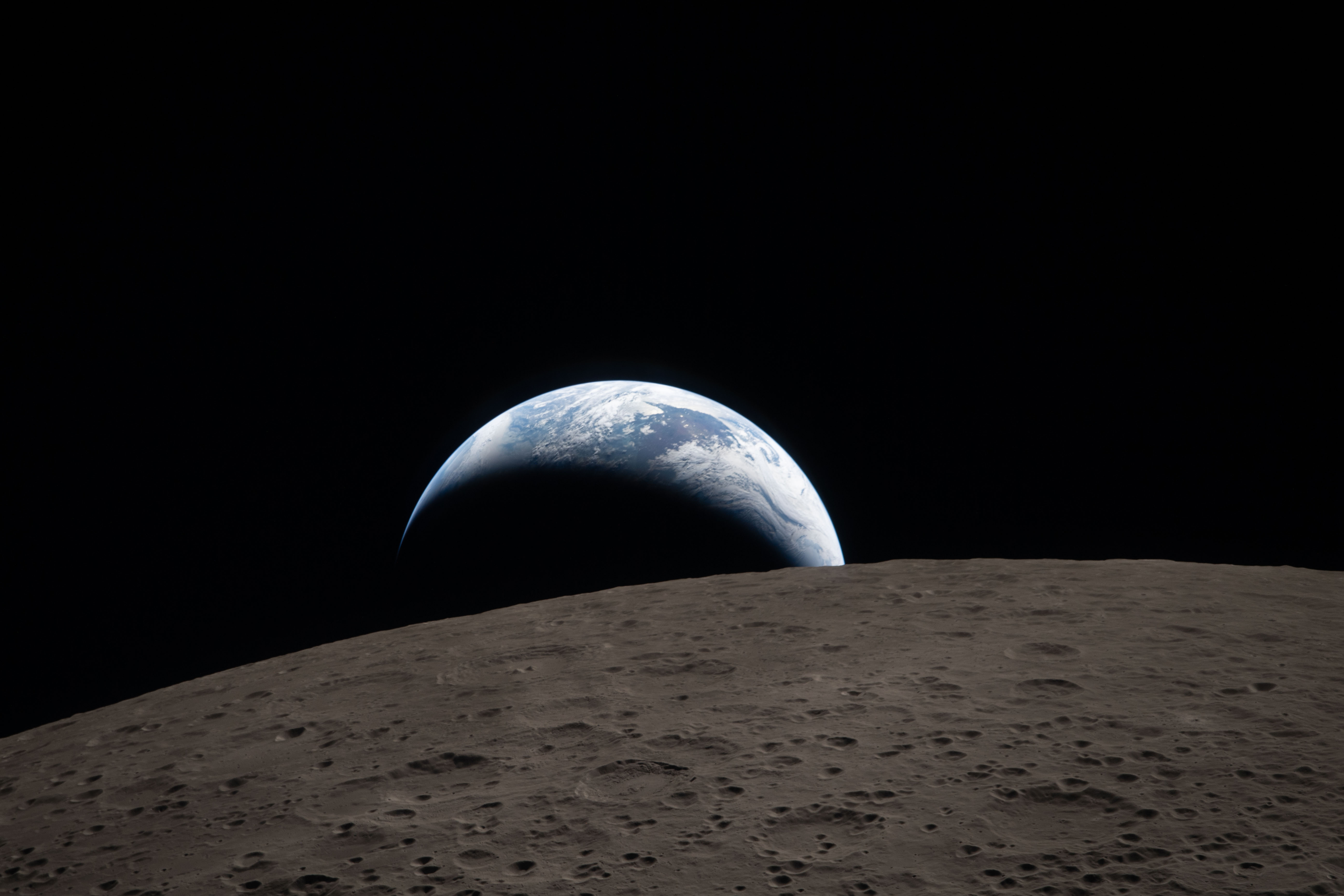 Earth rises on the moon's surface'